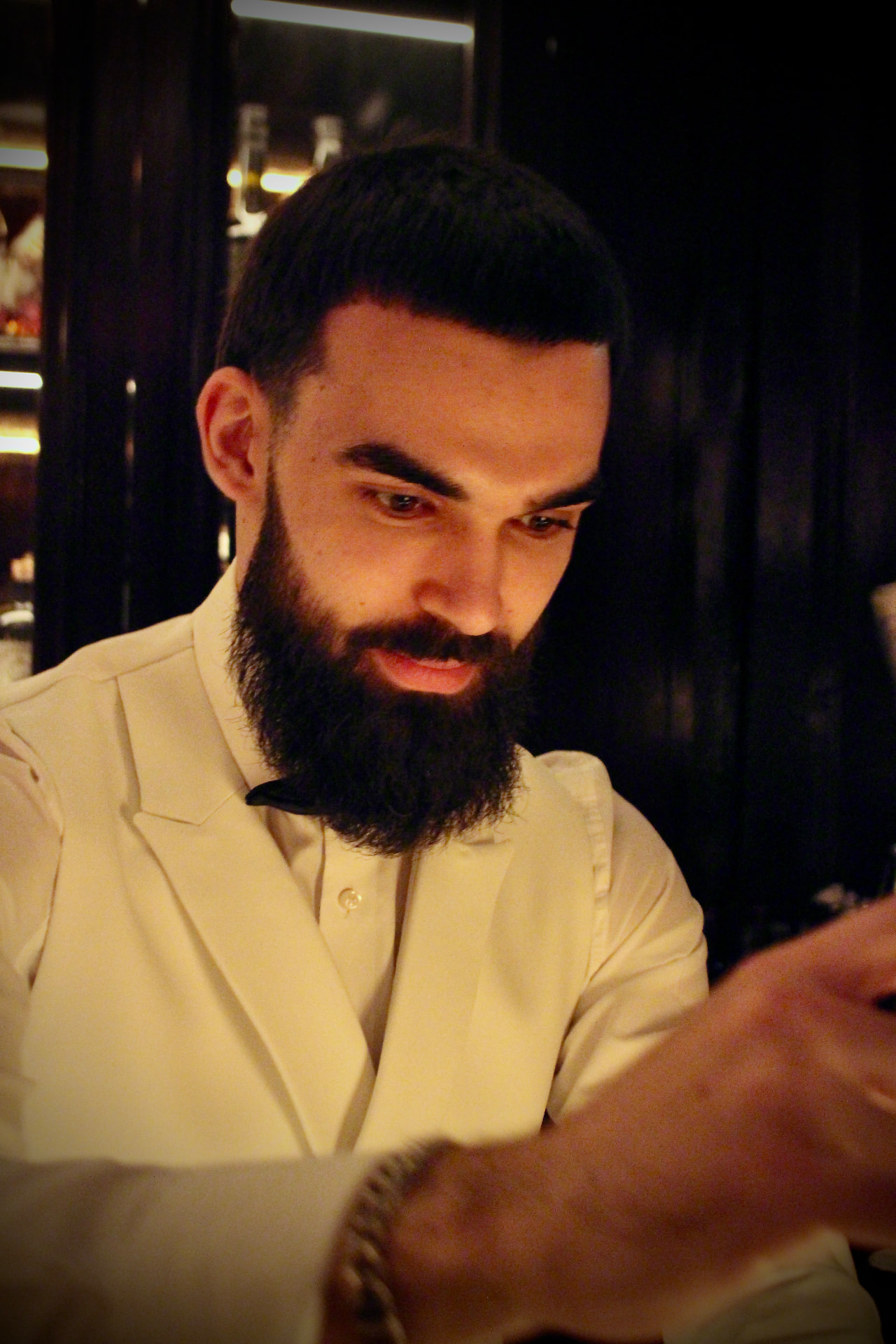 The Rockthehighball bartender building a cocktail during service