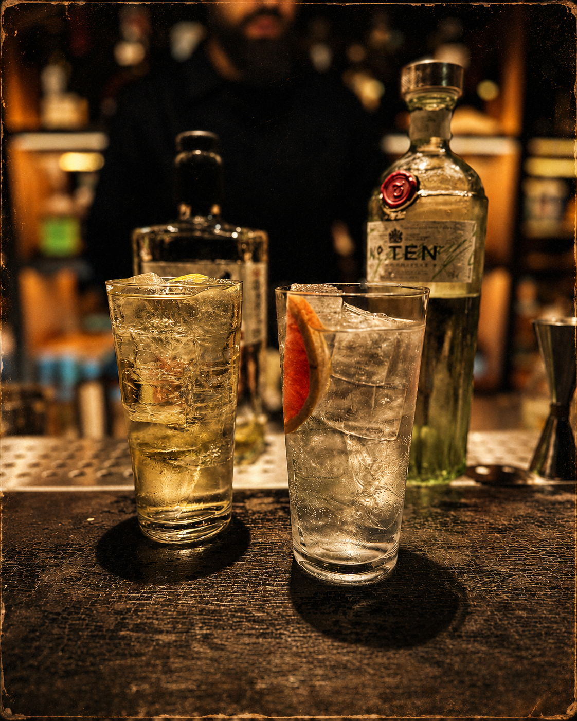 Two tall highball cocktails with citrus garnish, freshly poured at the Rockthehighball bar
